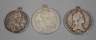 Drei gehenkelte historische Münzen