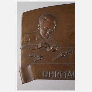 Bronzerelief Uhrmacherwerkstätte