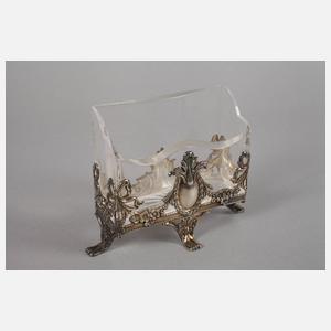 Vier Flakons und ein Serviettenhalter