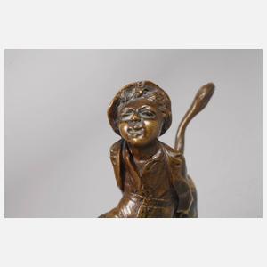 Knabe auf bockendem Esel