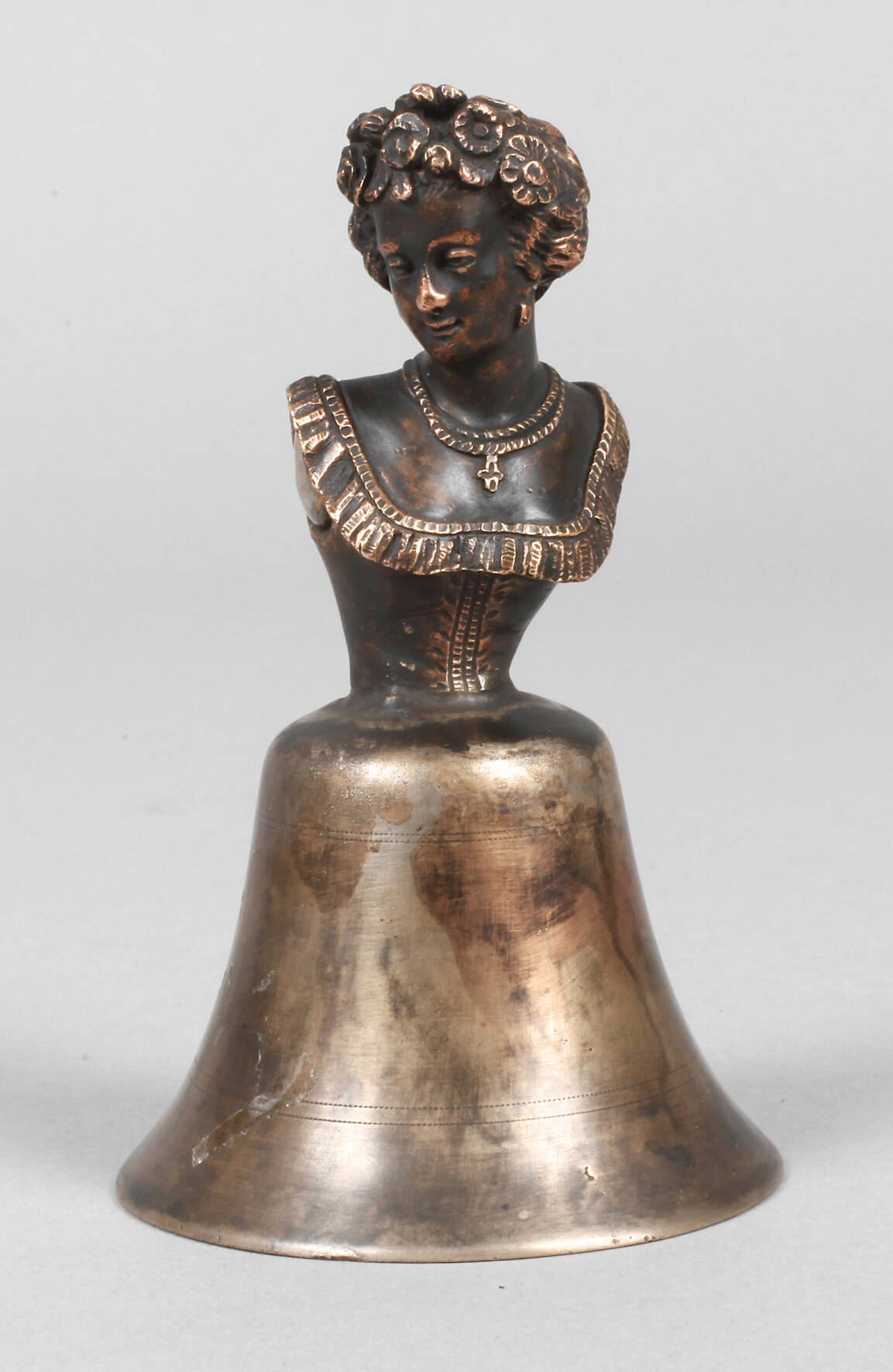 Figürliche Tischglocke