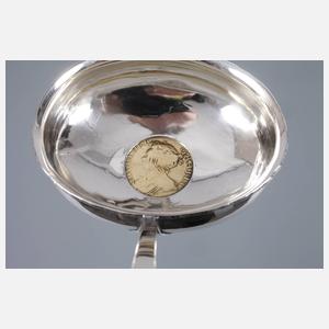 Kelle mit Goldmünze