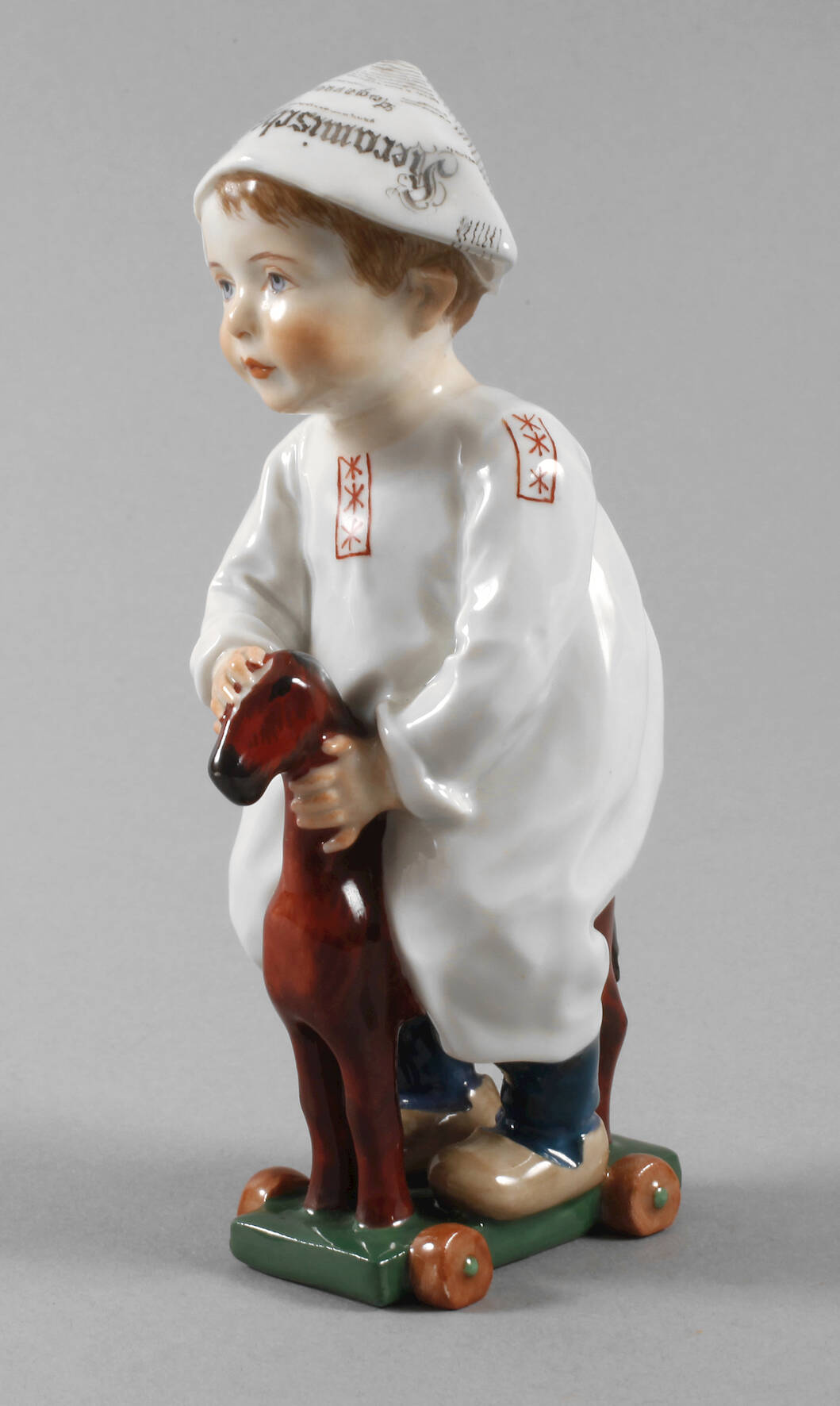 Meissen "Kind auf einem Holzpferd reitend"