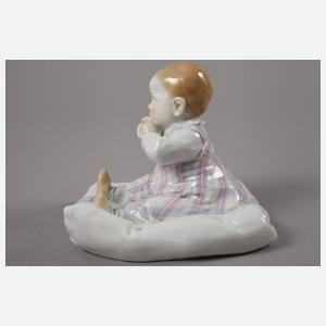 Meissen "Kind, auf einem Kissen sitzend"
