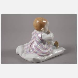 Meissen "Kind, auf einem Kissen sitzend"