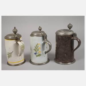 Drei Fayencewalzenkrüge