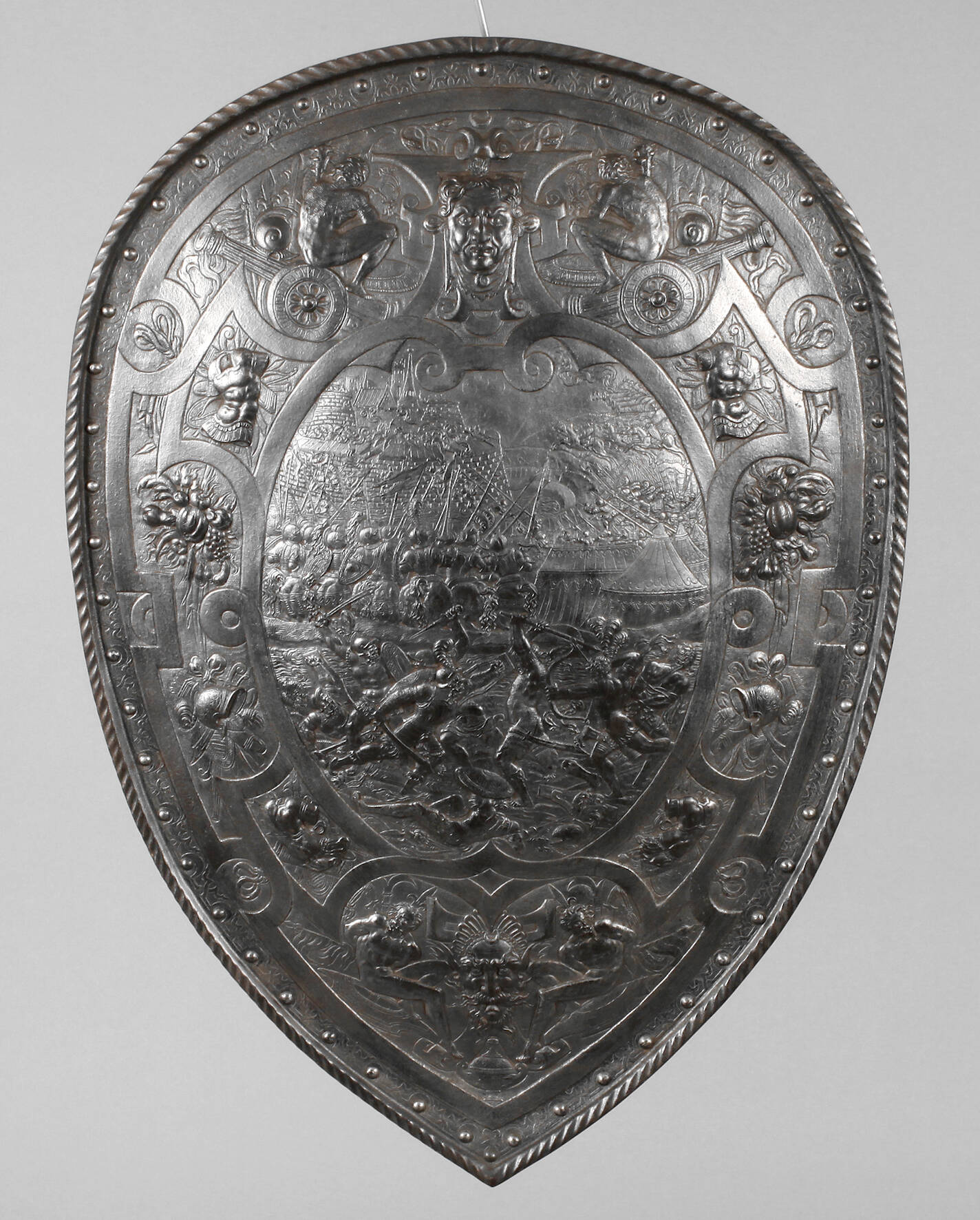 Wappenschild mit Schlachtenszene