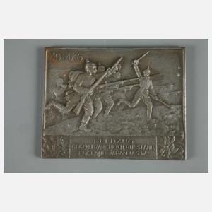 Eine Plakette und eine Medaille