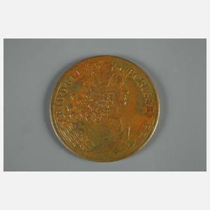 Eine Plakette und eine Medaille