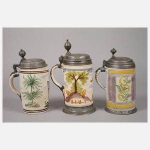 Drei Fayencewalzenkrüge