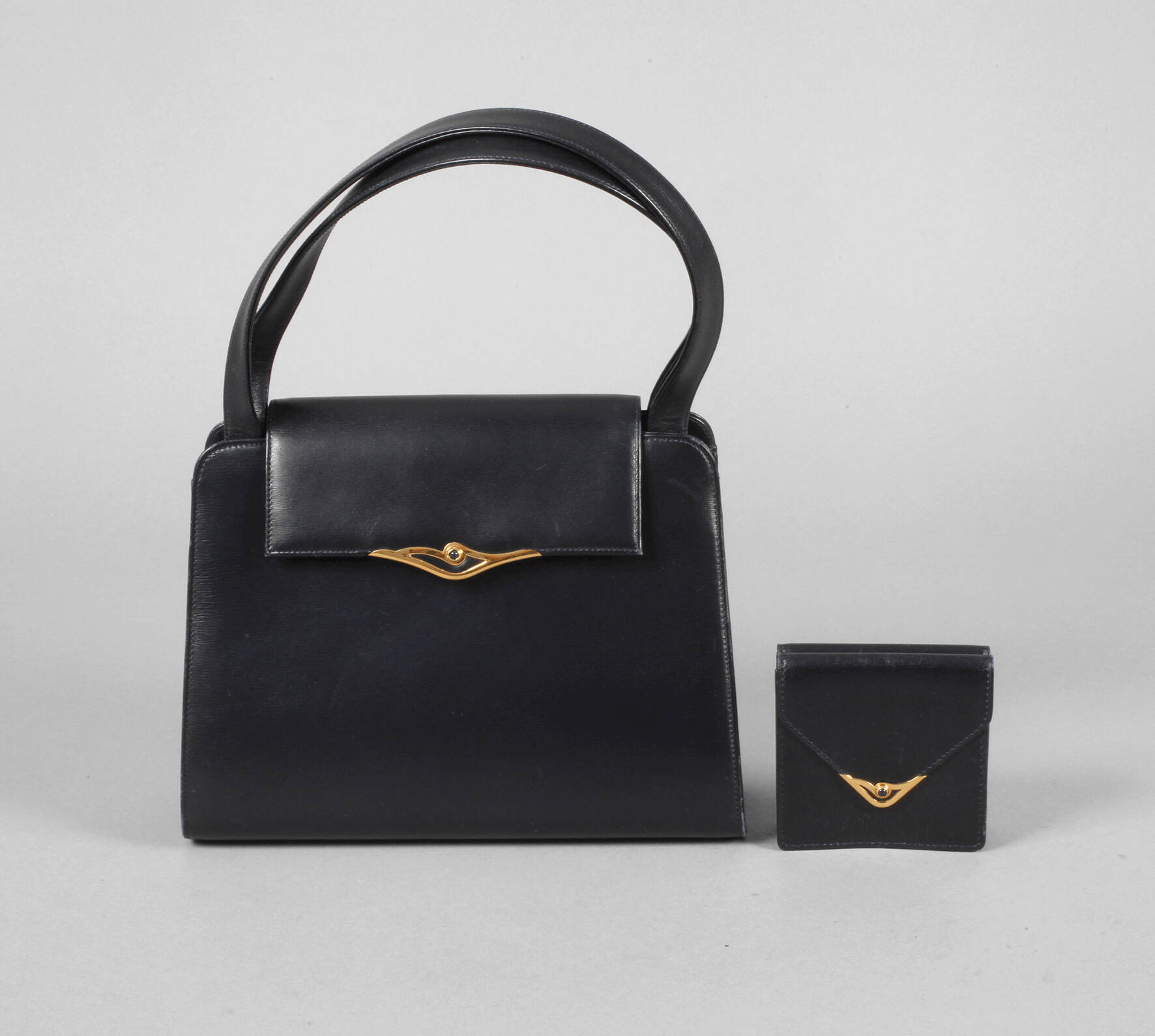 Handtasche und Portemonnaie Cartier