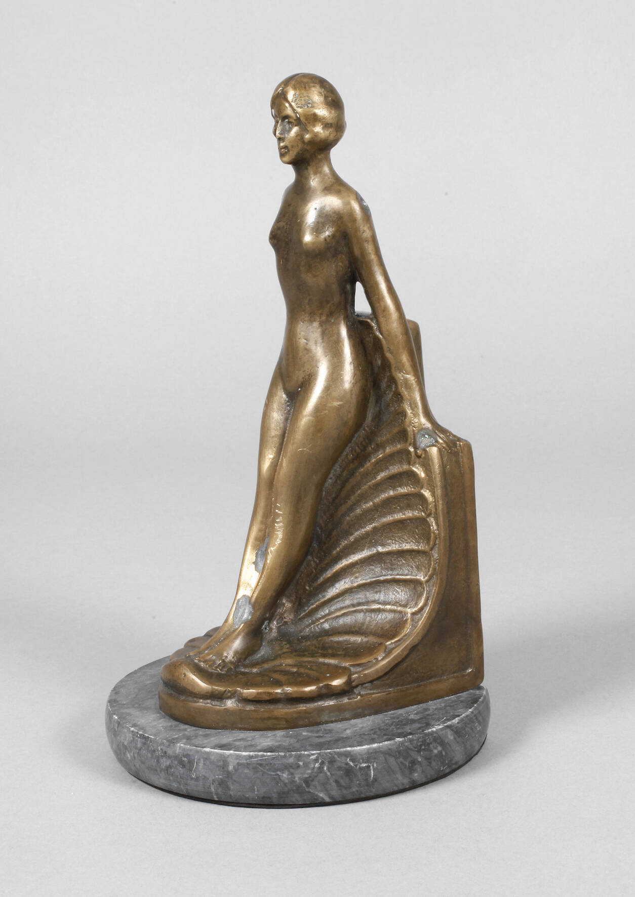 Figürliche Buchstütze