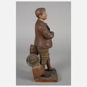 Goldscheider Wien Schuljunge mit Bilderrätsel