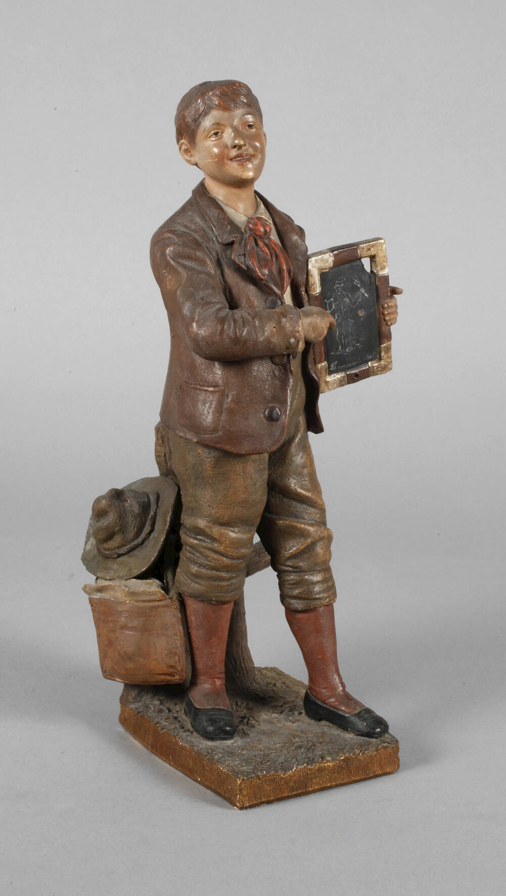 Goldscheider Wien Schuljunge mit Bilderrätsel