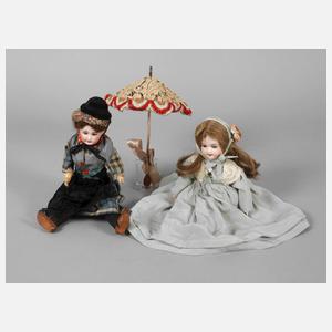 Zwei kleine Porzellankopfpuppen