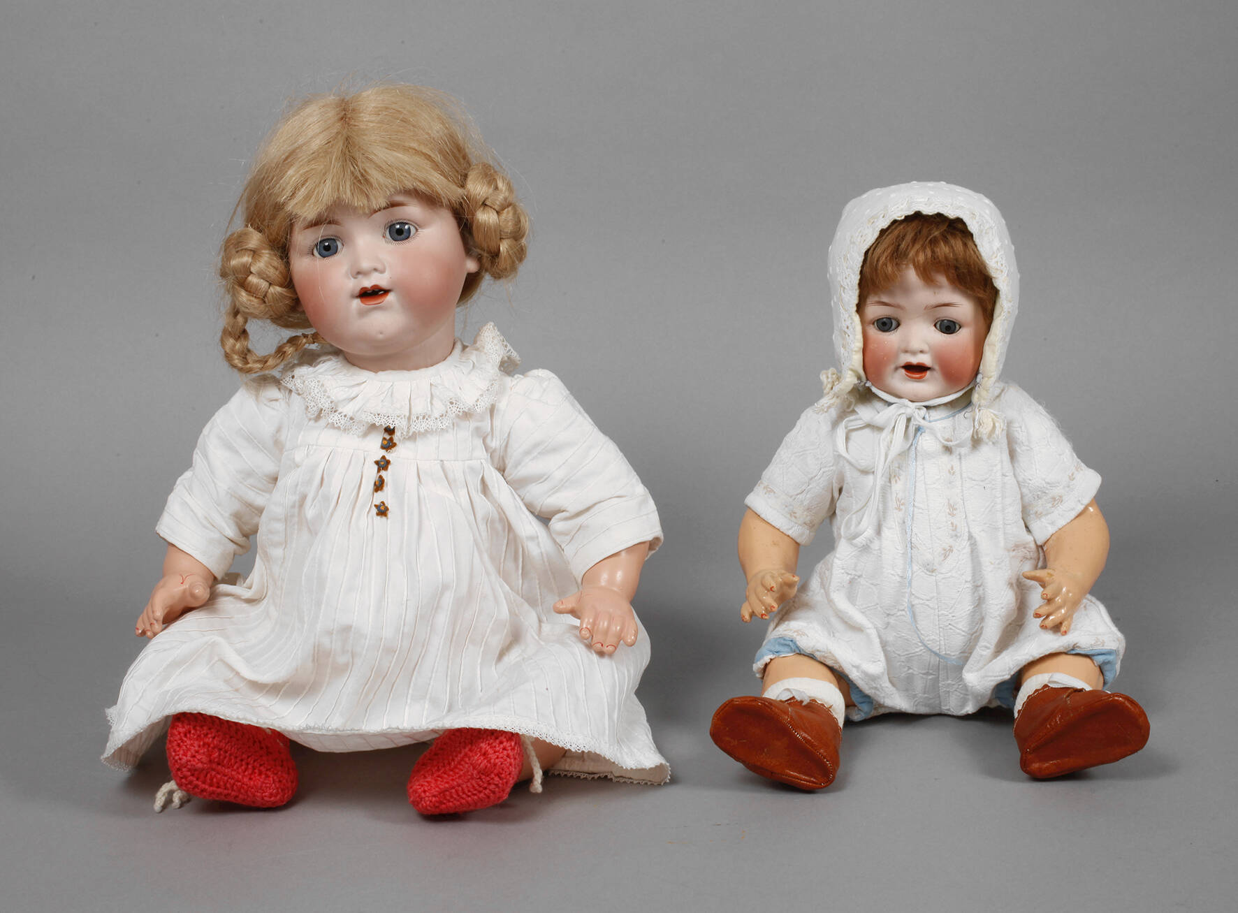 Zwei Porzellankopfpuppen als Charakterbabys