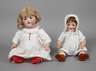 Zwei Porzellankopfpuppen als Charakterbabys