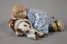 Meissen "Kind, auf einem Hund liegend"