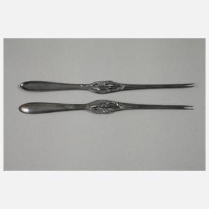 Zwölf Hummergabeln im Etui