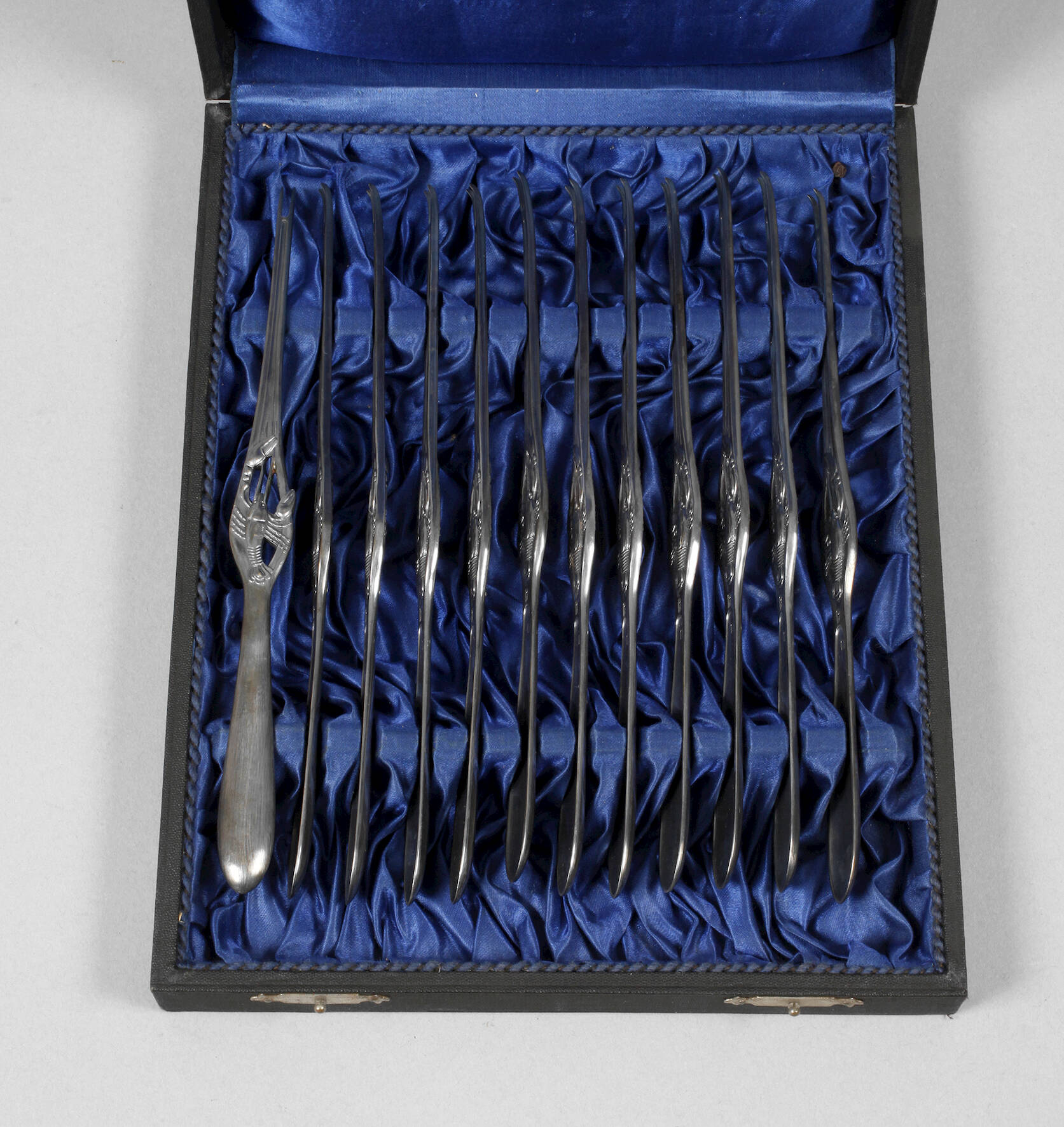 Zwölf Hummergabeln im Etui