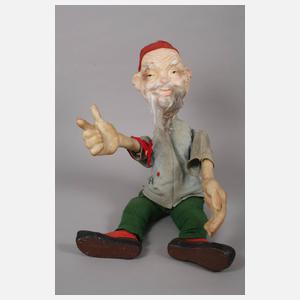 Werbefigur und Teedose