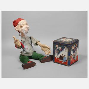 Werbefigur und Teedose