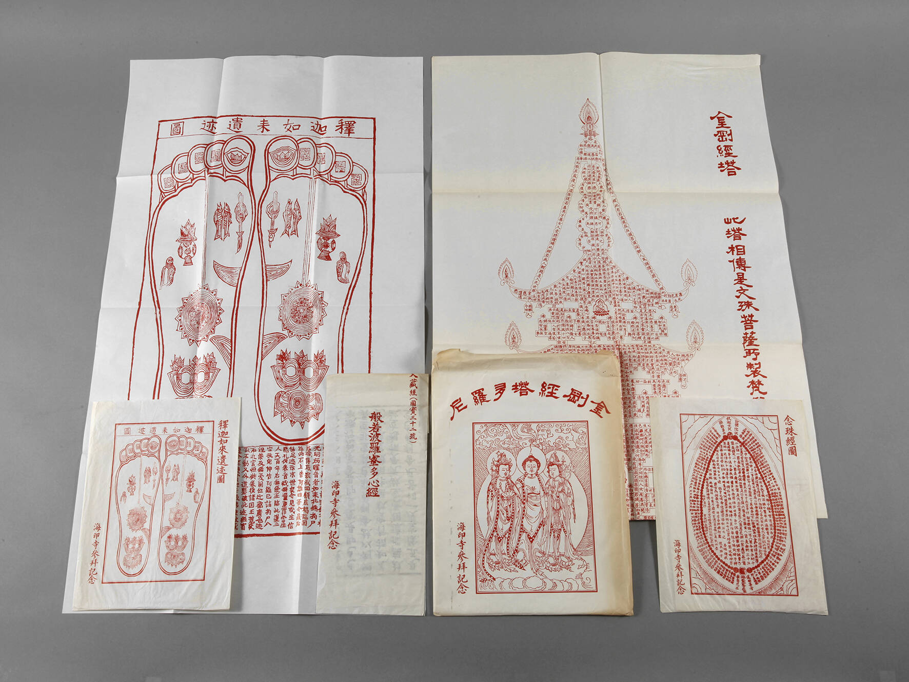 Drei buddhistische Plakate