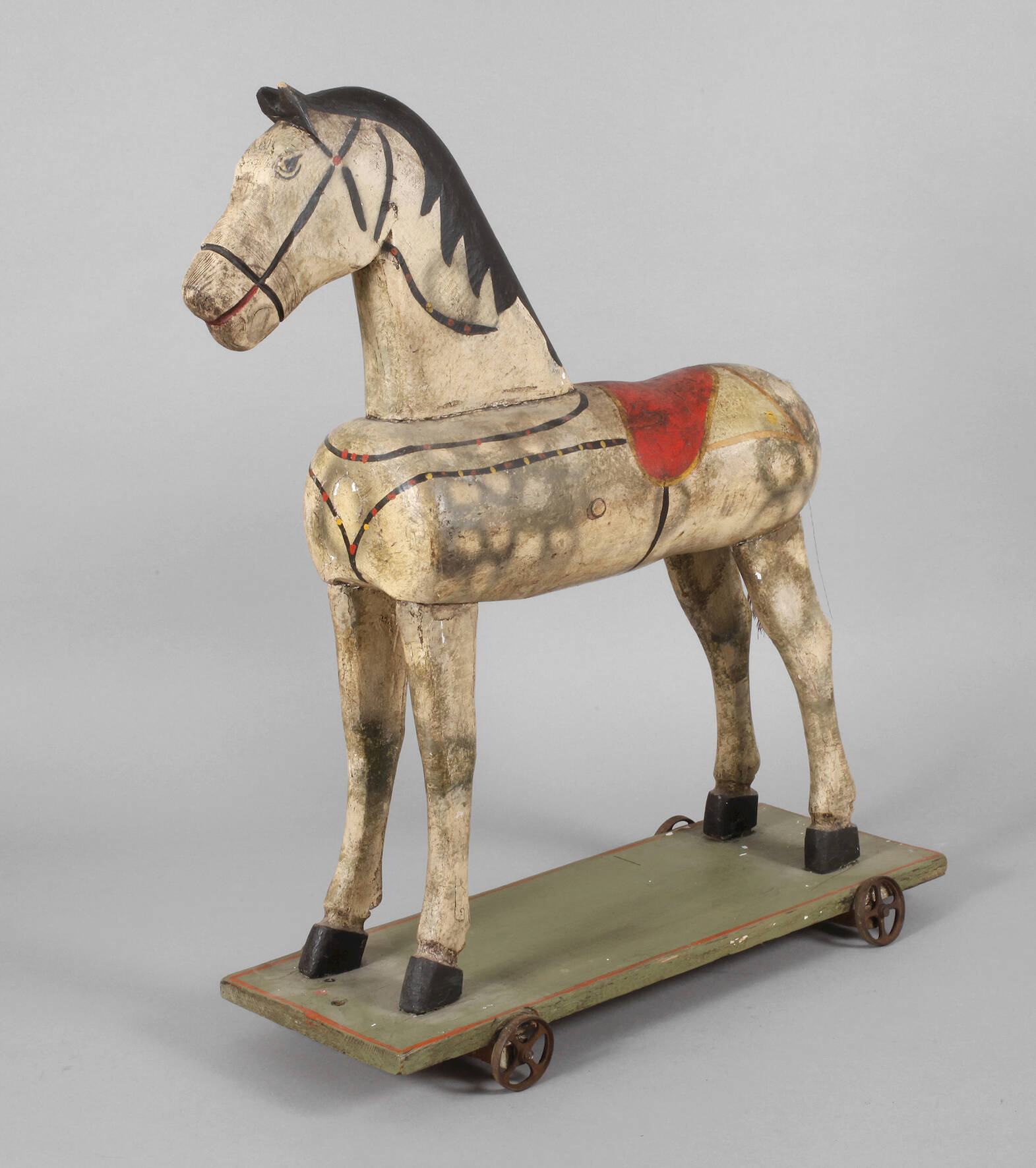 Holzpferd auf Rädern