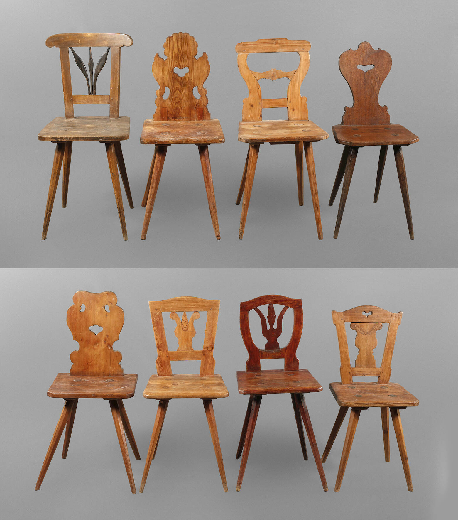 Acht bäuerliche Brettstühle