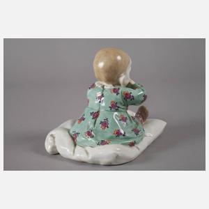 Meissen ”Kind, auf einem Kissen sitzend”