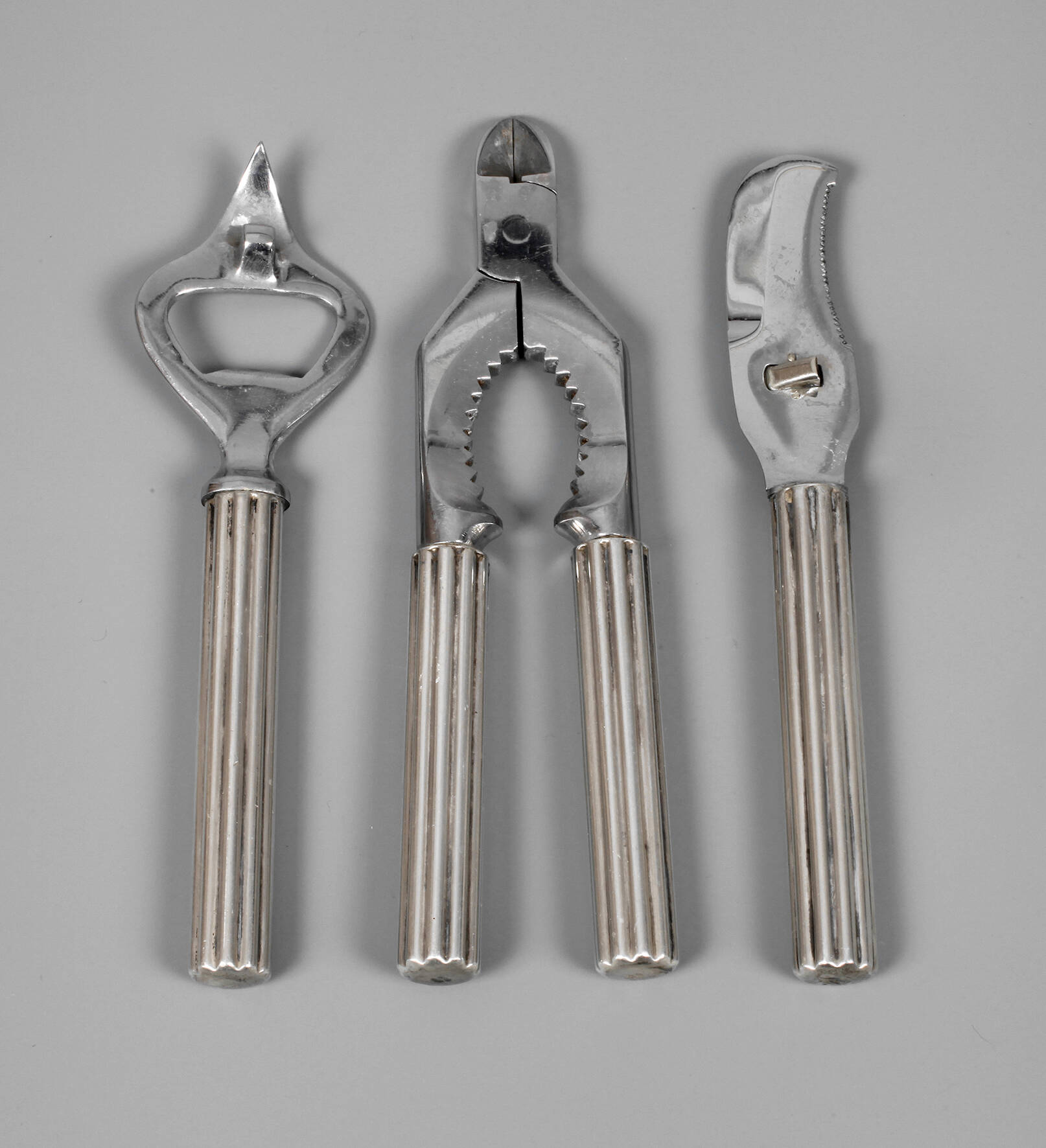 Drei Teile Hummerbesteck und Flaschenöffner