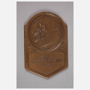 Fünf Motorradplaketten