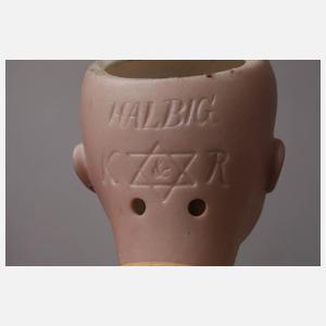 Drei kleine Porzellankopfpuppen mit Kindergesicht