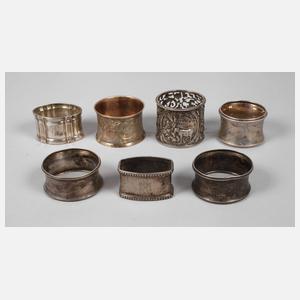 Sieben Serviettenringe Silber