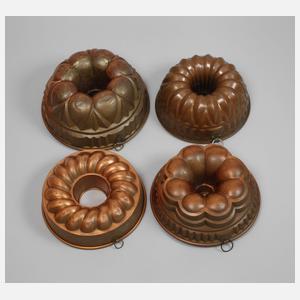 Vier Kupferbackformen