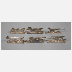Sechs figürliche Messerbänkchen Art déco
