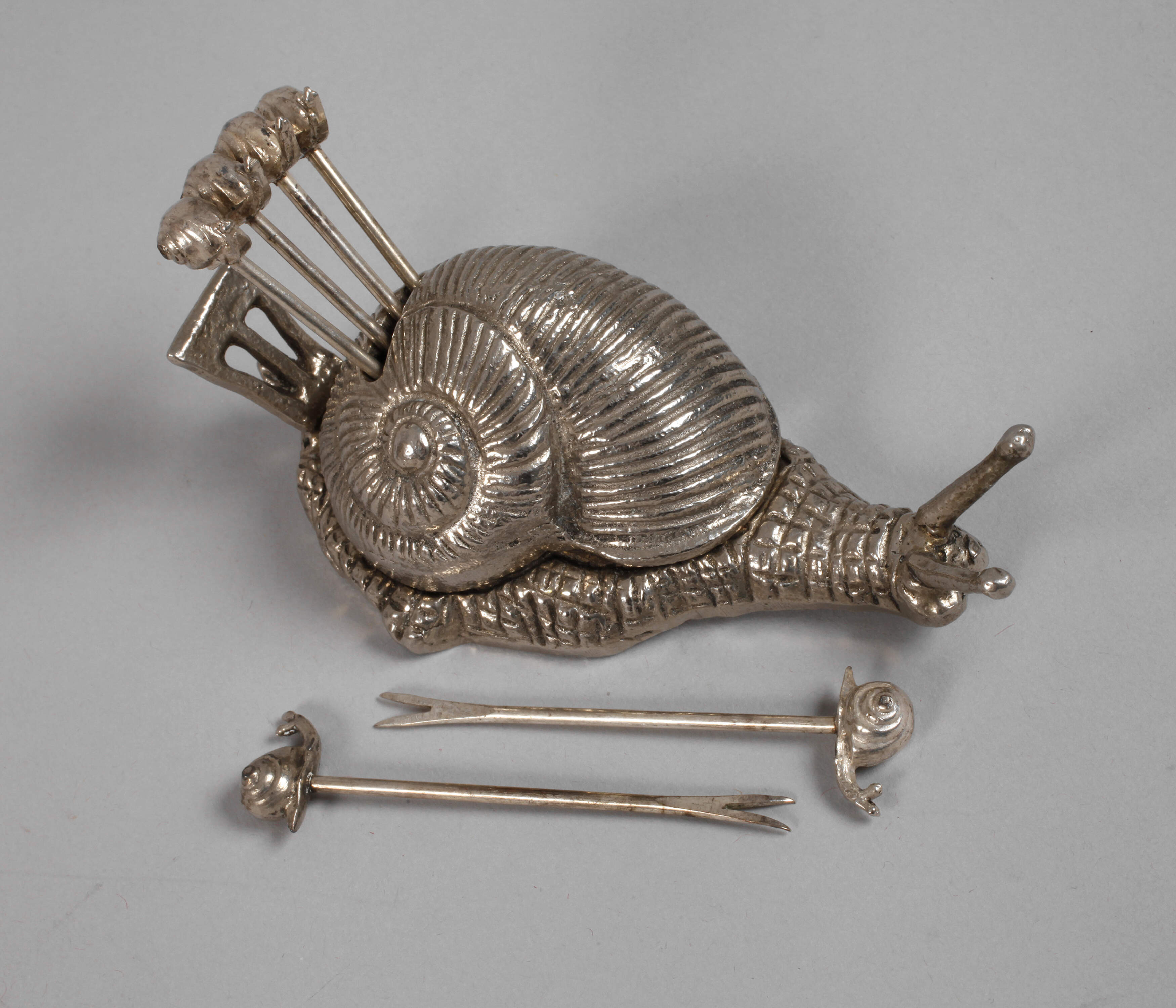 Schnecke mit Cocktailspießen