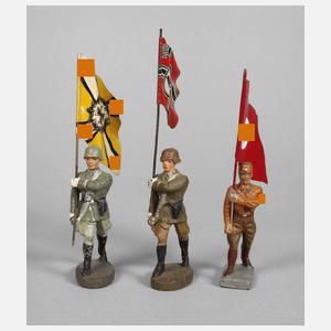 Drei Fahnenträger im Marsch