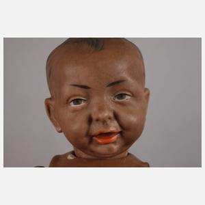 Zwei Porzellankopfpuppen als Afrikaner