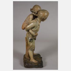 Kinderfigur Huckepack