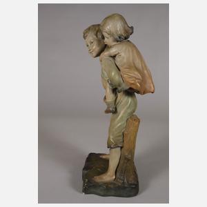 Kinderfigur Huckepack