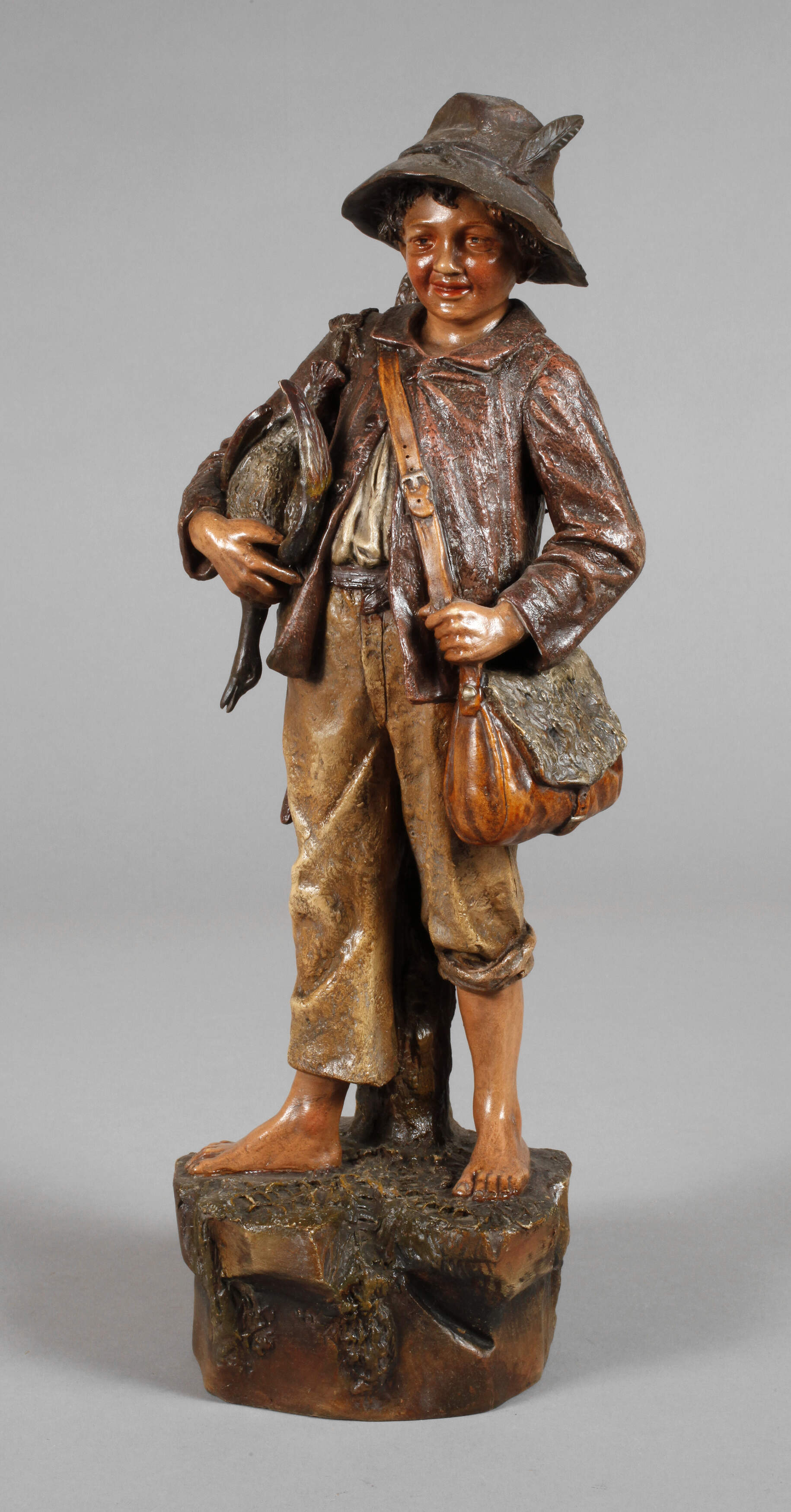 Jägersbursche mit Ente und Hase