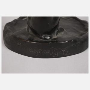 Drei kleine Dackelskulpturen