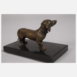 Drei kleine Dackelskulpturen