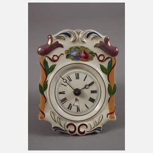 Vier kleine Porzellanschilderuhren