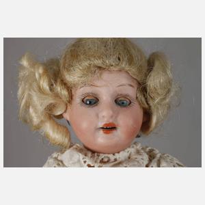 Zwei kleine Porzellankopfpuppen