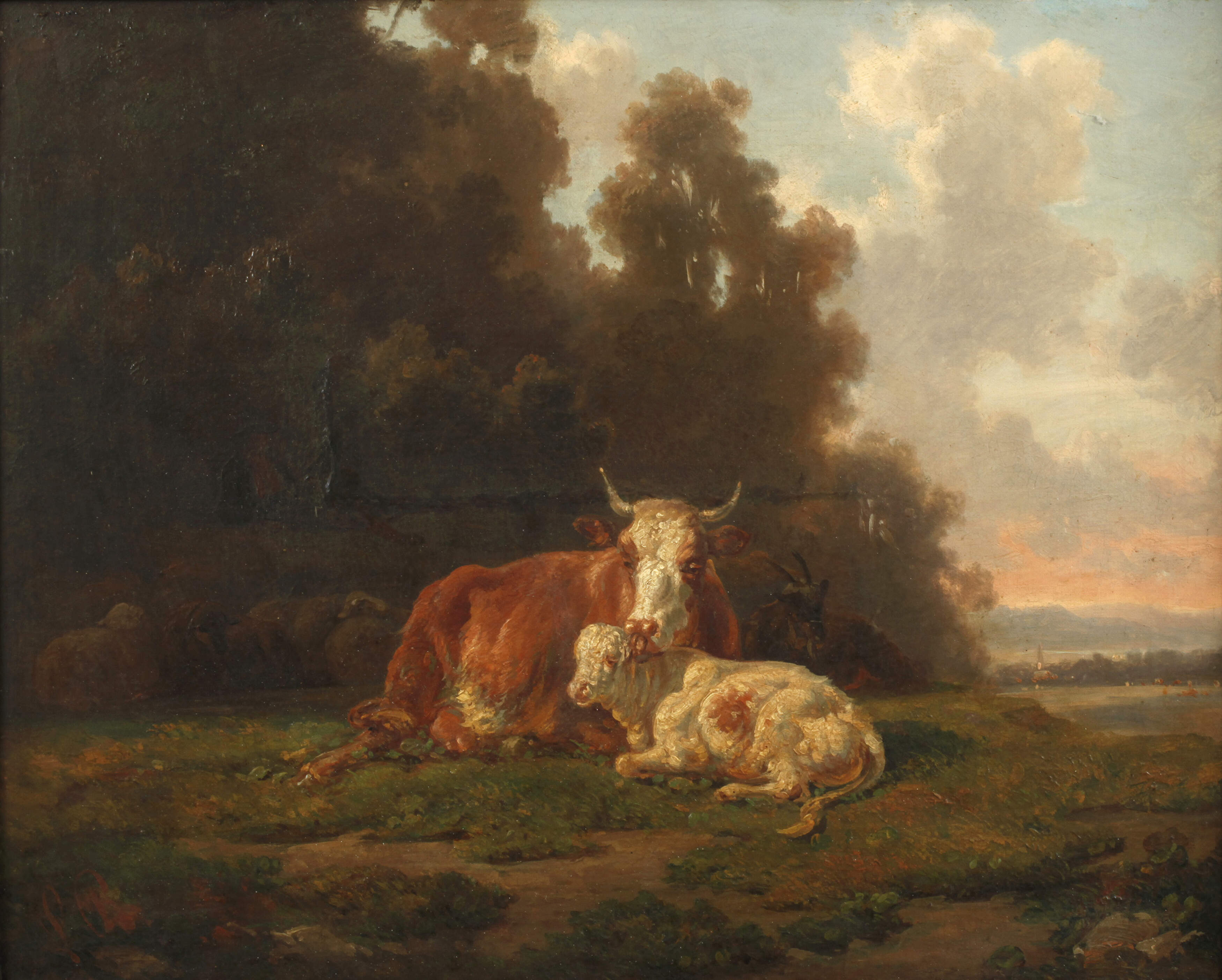 Kühe und Ziegen vor Dorfkulisse