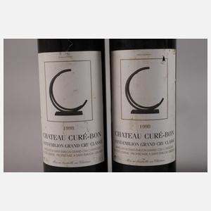 Vier Flaschen Rotwein