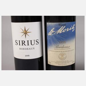 Vier Flaschen Rotwein