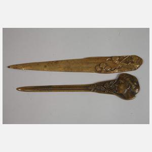 Acht figürliche Brieföffner